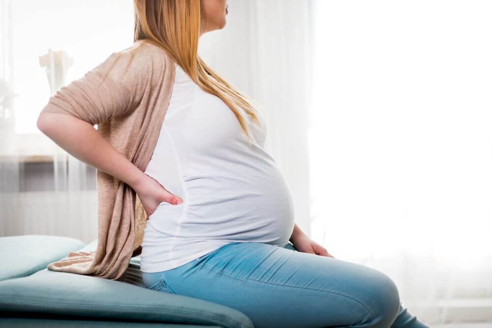 Whats causing my back to ache so badly in pregnancy ?